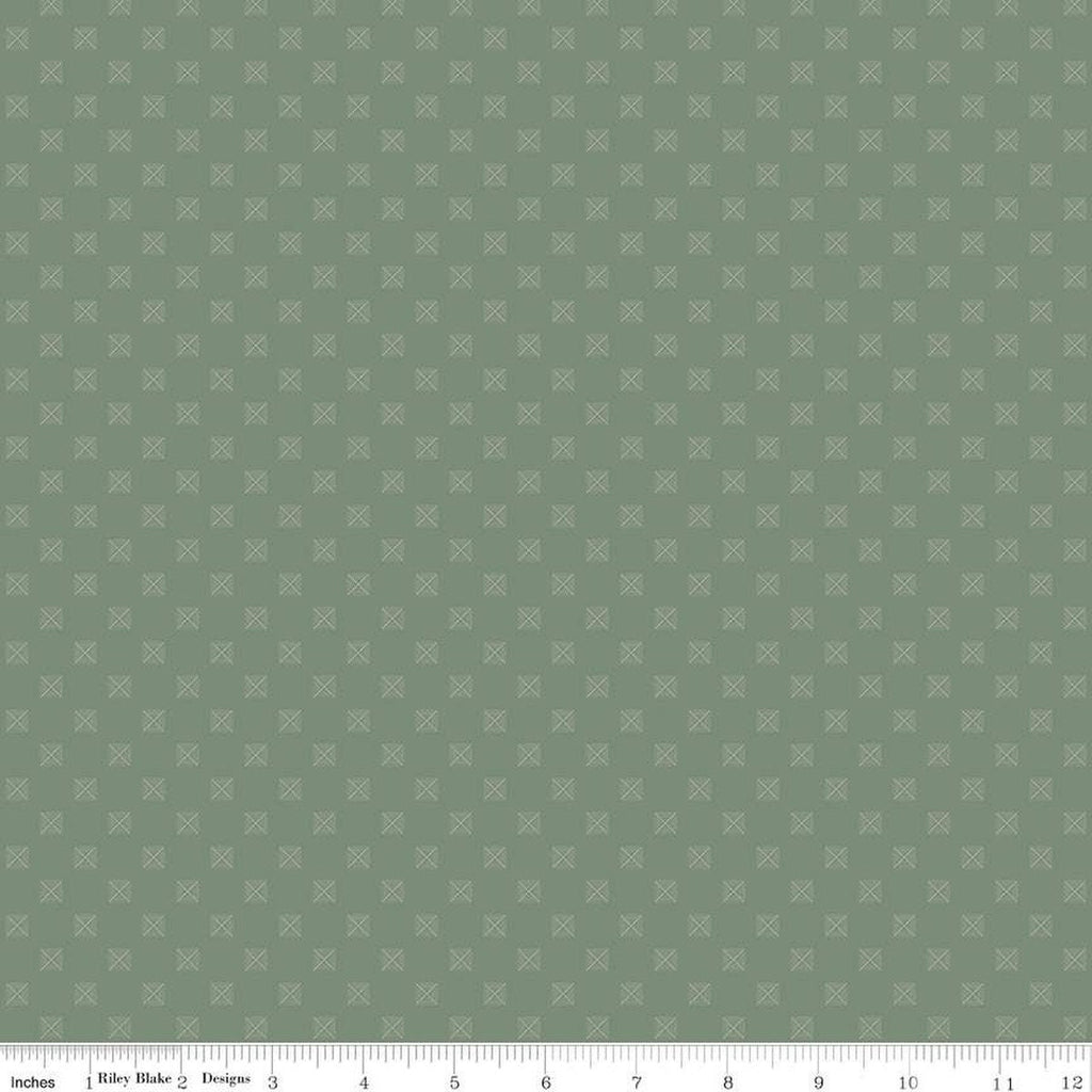 Sage green quilting cotton fabric with squares in a grid. Each square is about 1/4" wide. There are white X's within the squares
Cute Little Fabric Shop