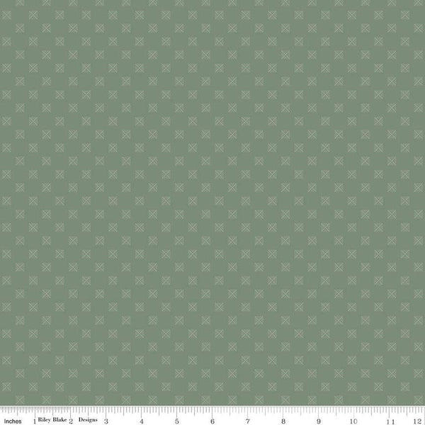 Sage green quilting cotton fabric with squares in a grid. Each square is about 1/4" wide. There are white X's within the squares
Cute Little Fabric Shop