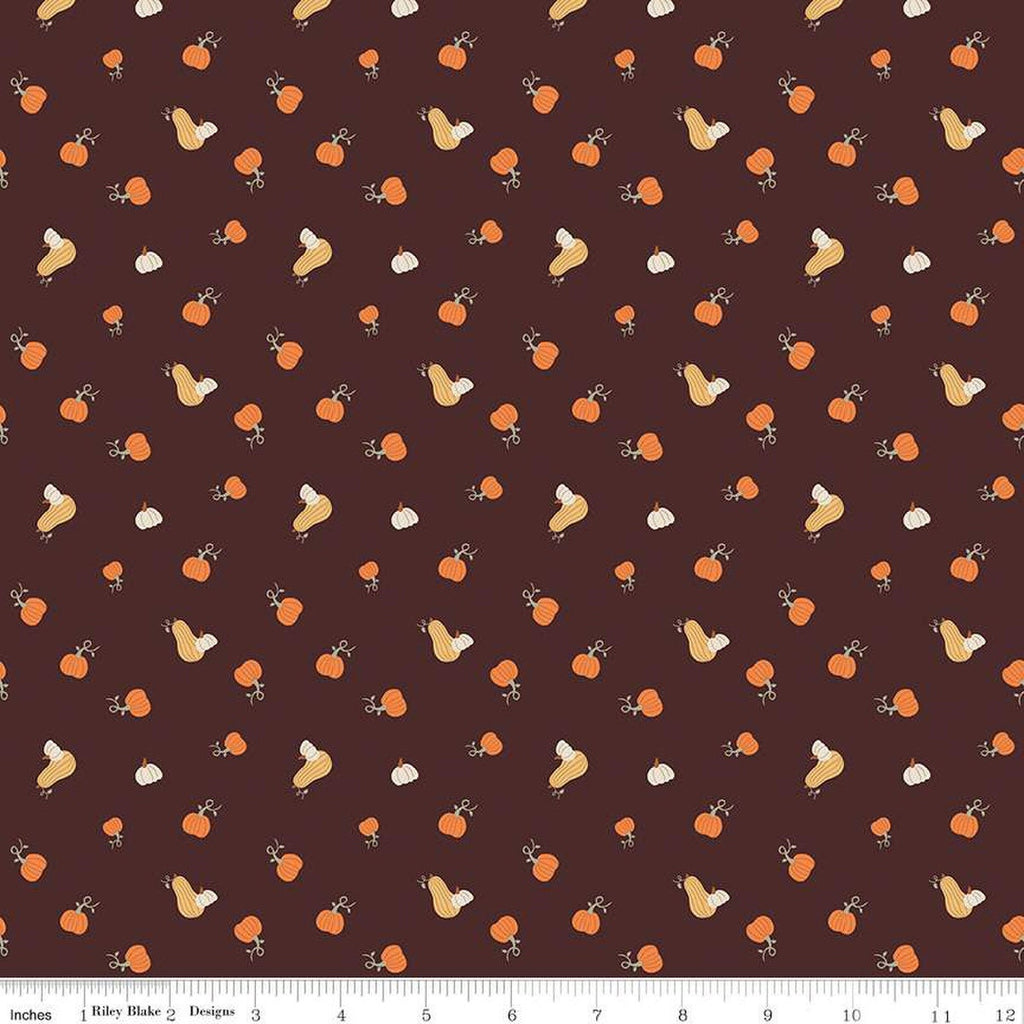Image of espresso brown colored quilting cotton fabric for the Pumpkin Spice collection by Riley Blake Designs. Features scattered and tossed orange, yellow, and cream pumpkins on the espresso background. 
Cute Little Fabric Shop