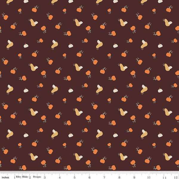 Image of espresso brown colored quilting cotton fabric for the Pumpkin Spice collection by Riley Blake Designs. Features scattered and tossed orange, yellow, and cream pumpkins on the espresso background. 
Cute Little Fabric Shop