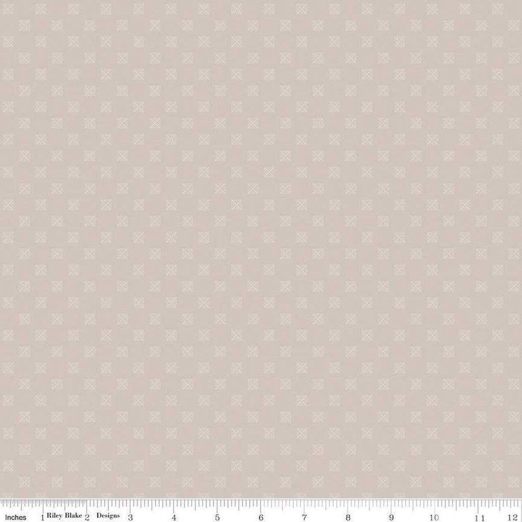 Cream, light tan, sand colored quilting cotton fabric with squares in a grid. Each square is about 1/4" wide. There are white X's within the squares
Cute Little Fabric Shop