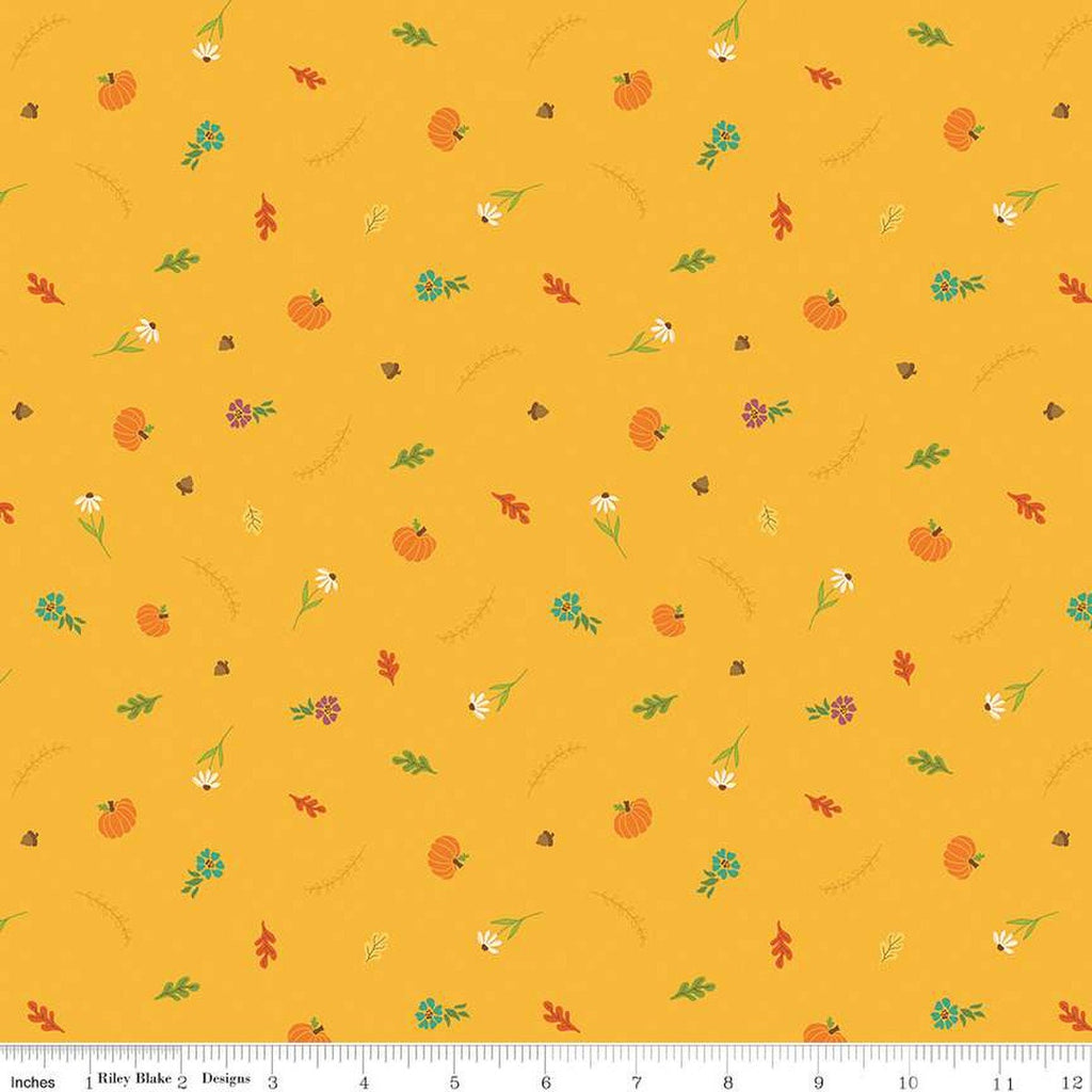 Image of the Autumn Afternoon Fall Toss Saffron quilting cotton fabric by Heather Peterson for Riley Blake Designs. Features scattered flowers, pumpkins, and acorns on a yellow background. 
Cute Little Fabric Shop