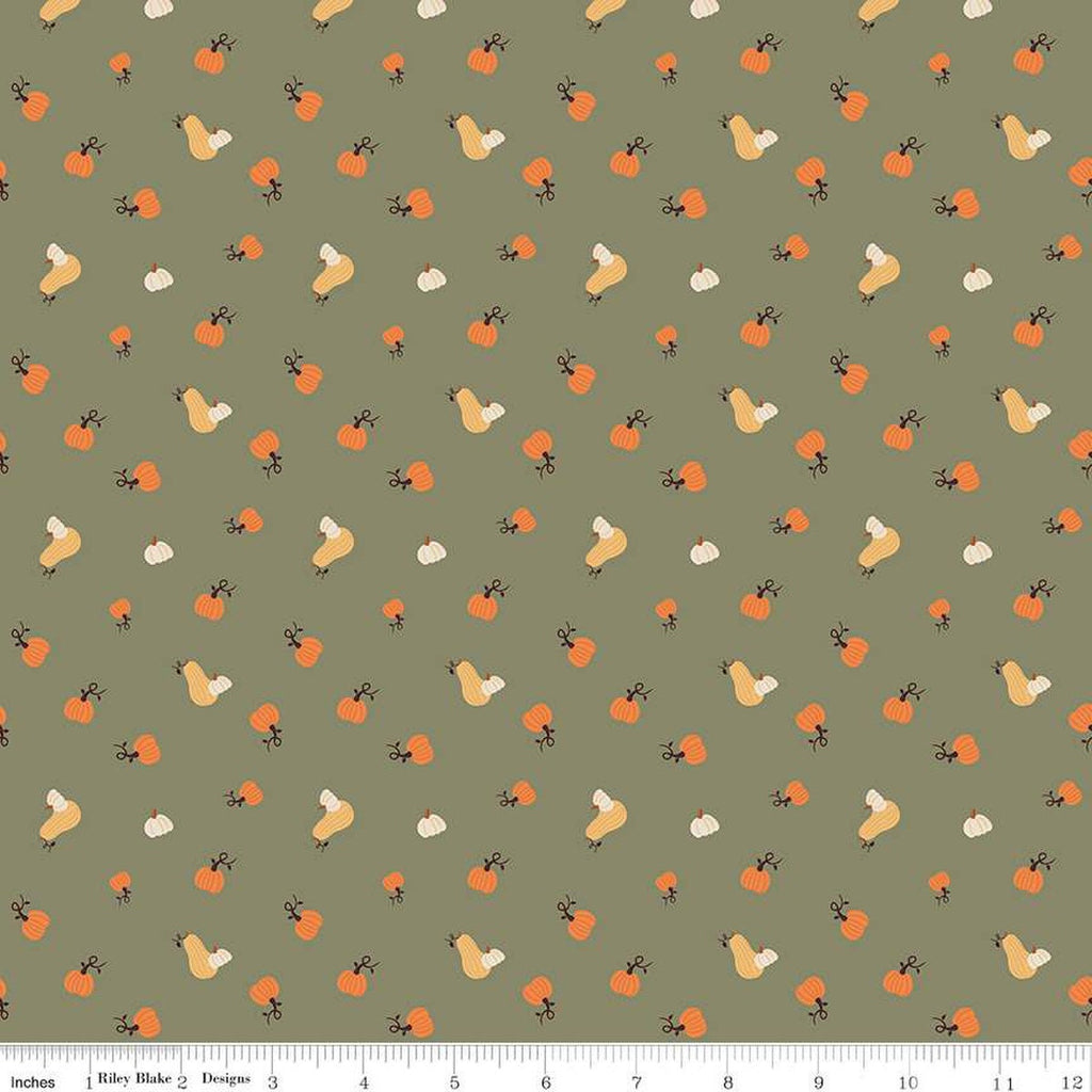 Image of olive green colored quilting cotton fabric for the Pumpkin Spice collection by Riley Blake Designs. Features scattered and tossed orange, yellow, and cream pumpkins on the olive background. 
Cute Little Fabric Shop