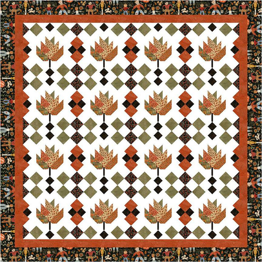 Image of the Sew-N-Quilt Raking Leaves Quilt Pattern by LaVonne Jackson for Riley Blake Designs. Features pieced leaves with squares on a light white background and a black border. 
Cute Little Fabric Shop