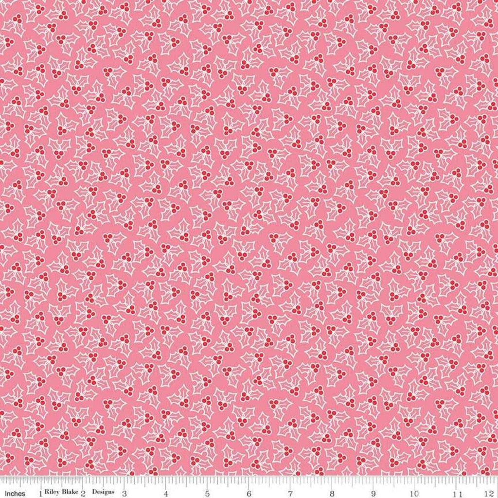 Image of the Cozy Christmas Holly Pink fabric by Riley Blake Designs. Features tossed holly and berries on a pink background. 
Cute Little Fabric Shop