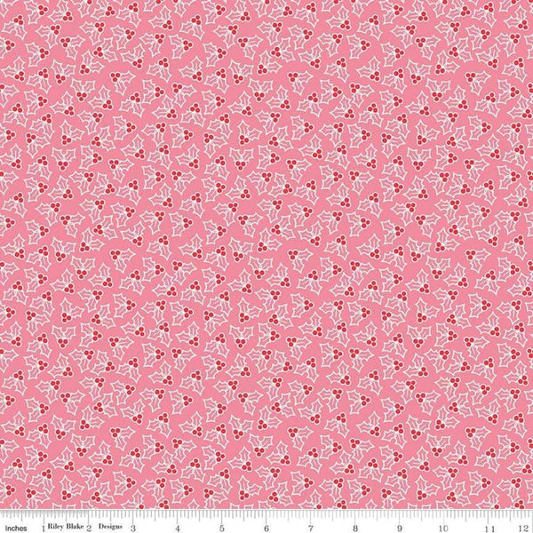 Image of the Cozy Christmas Holly Pink fabric by Riley Blake Designs. Features tossed holly and berries on a pink background. 
Cute Little Fabric Shop