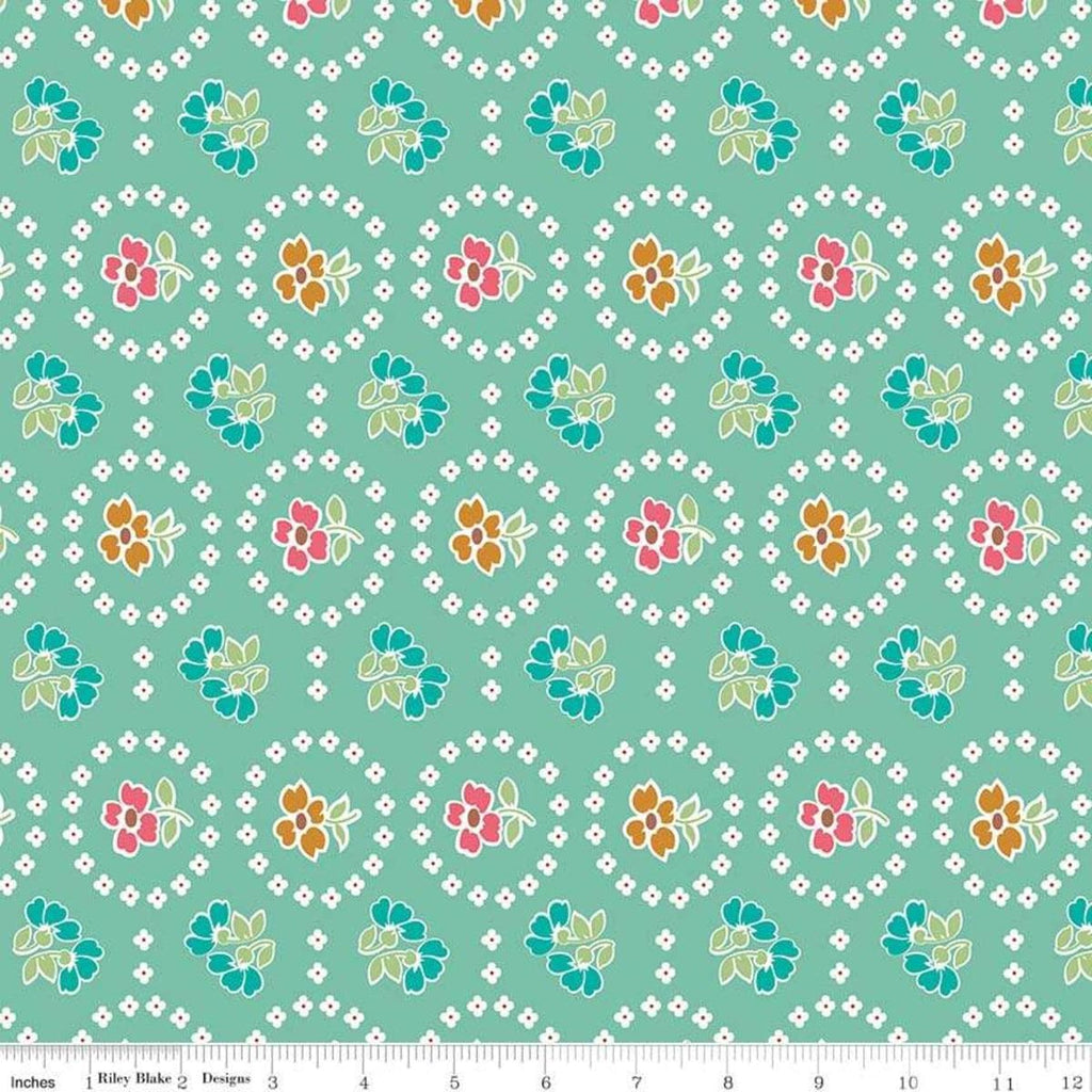 Image of the Granny Chic Curtains Teal quilting cotton fabric by Lori Holt for Riley Blake Designs. Features a flower bordered by a circle of small white flowers on a mint background. 
Cute Little Fabric Shop