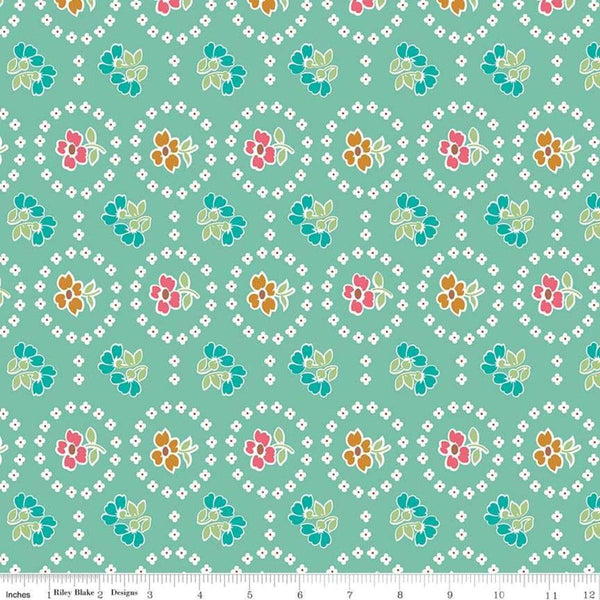 Image of the Granny Chic Curtains Teal quilting cotton fabric by Lori Holt for Riley Blake Designs. Features a flower bordered by a circle of small white flowers on a mint background. 
Cute Little Fabric Shop