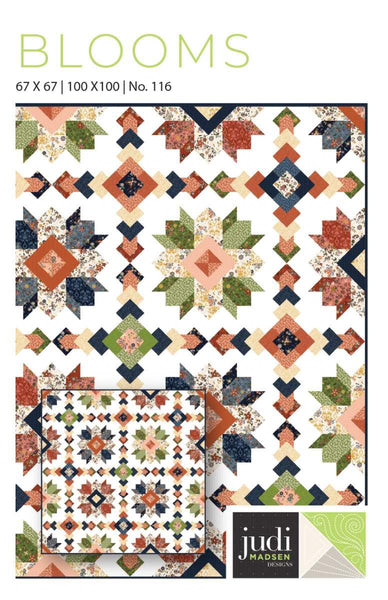 Image of the Blooms quilt pattern by Judy Madsen for Riley Blake Designs. Features stars, diamonds, and square patterns on a quilt. 
Cute Little Fabric Shop