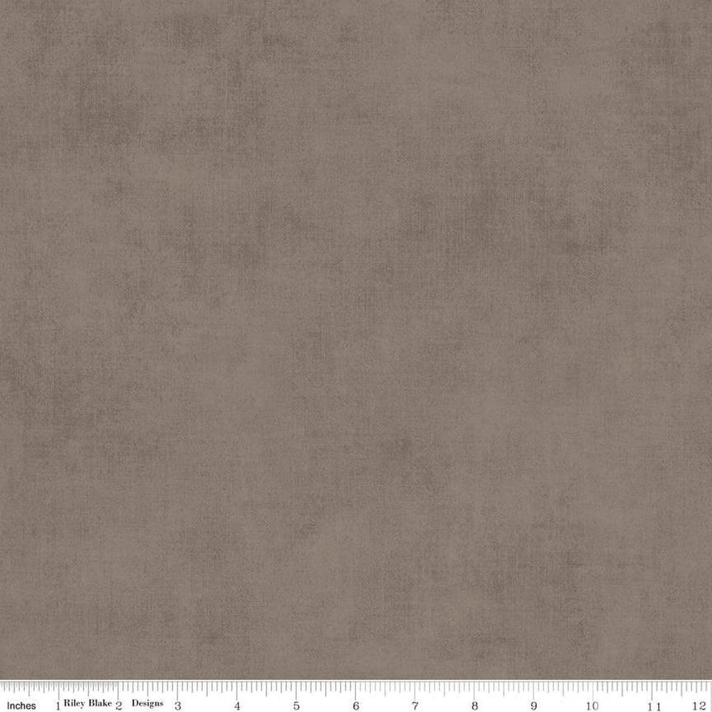 Image of the Shades Pebble quilting cotton fabric by Riley Blake Designs. Features a grey brown fabric with a mottled semisold background. 
Cute Little Fabric Shop