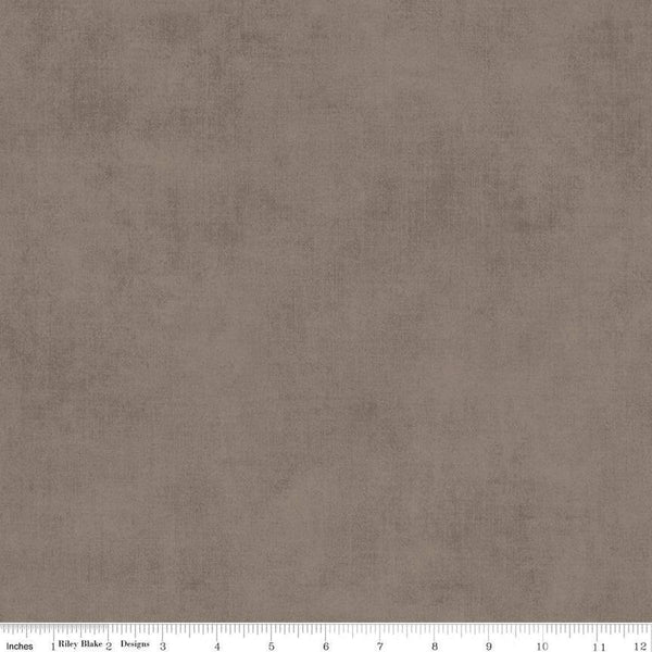 Image of the Shades Pebble quilting cotton fabric by Riley Blake Designs. Features a grey brown fabric with a mottled semisold background. 
Cute Little Fabric Shop