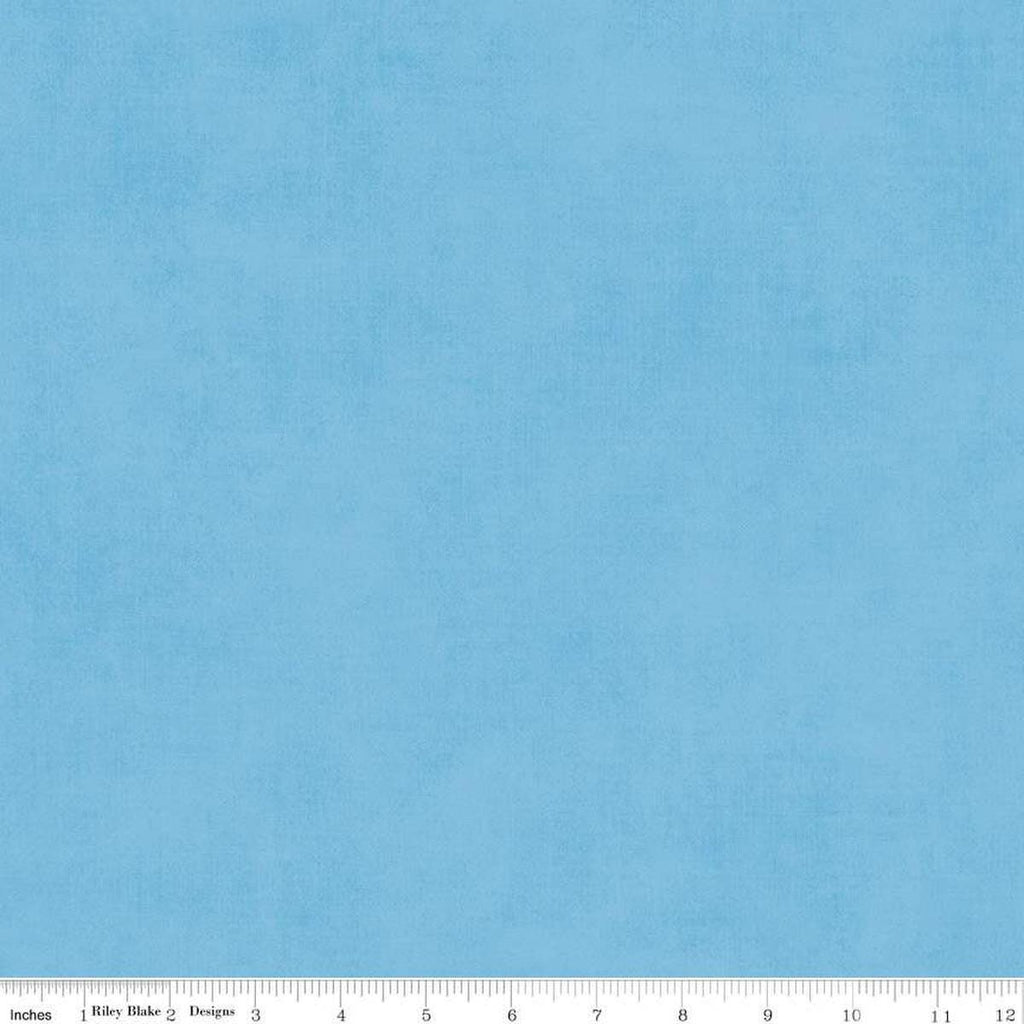 Image of the Shades Celestial quilting cotton fabric by Riley Blake Designs. Features a light blue fabric with a mottled semisold background. 
Cute Little Fabric Shop