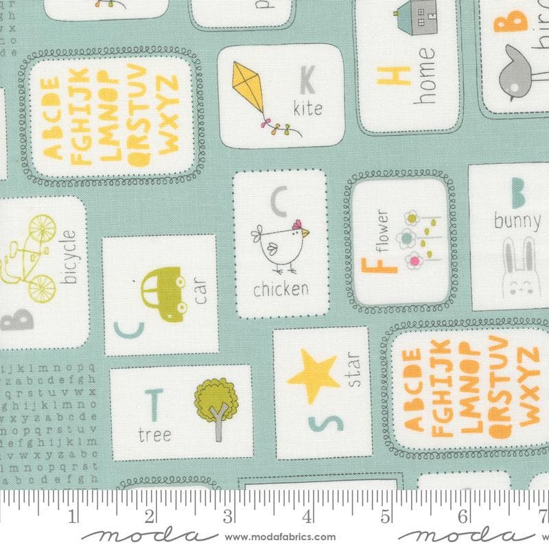 Image of the Shine Flashcards Sky quilting cotton fabric by Sweetwater for Moda Fabrics. Features alphabet flashcards with words and pictures on a light blue background. 
Cute Little Fabric Shop