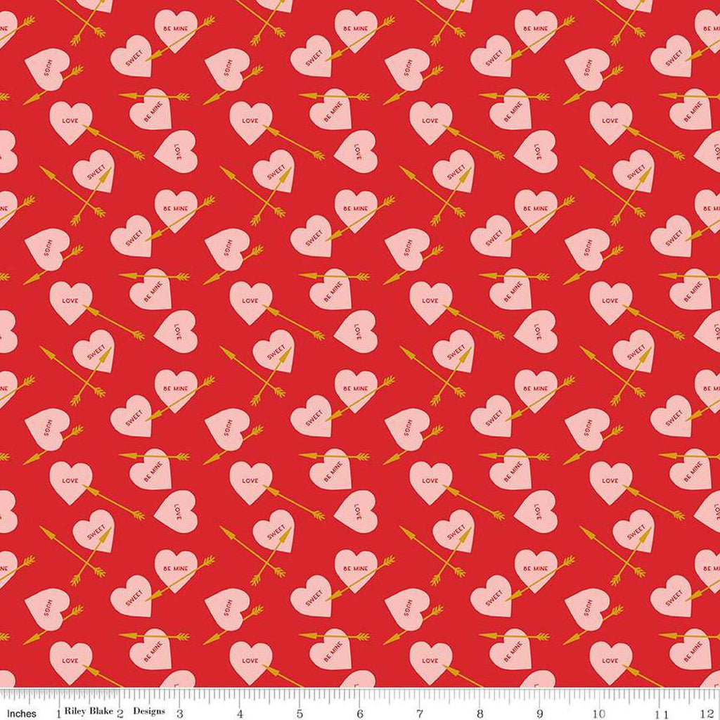 Image of the Sweetheart Heart Arrows Red quilting cotton fabric by My Minds Eye for Riley Blake Designs. Features conversation hearts and arrows on a red background.
Cute Little Fabric Shop