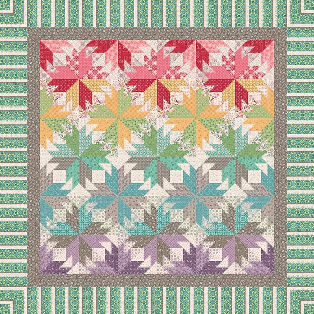 Image of the Indian Summer in Autumn quilt pattern by Quiltworx for Riley Blake Designs. Features a star pattern on a multicolored quilt.