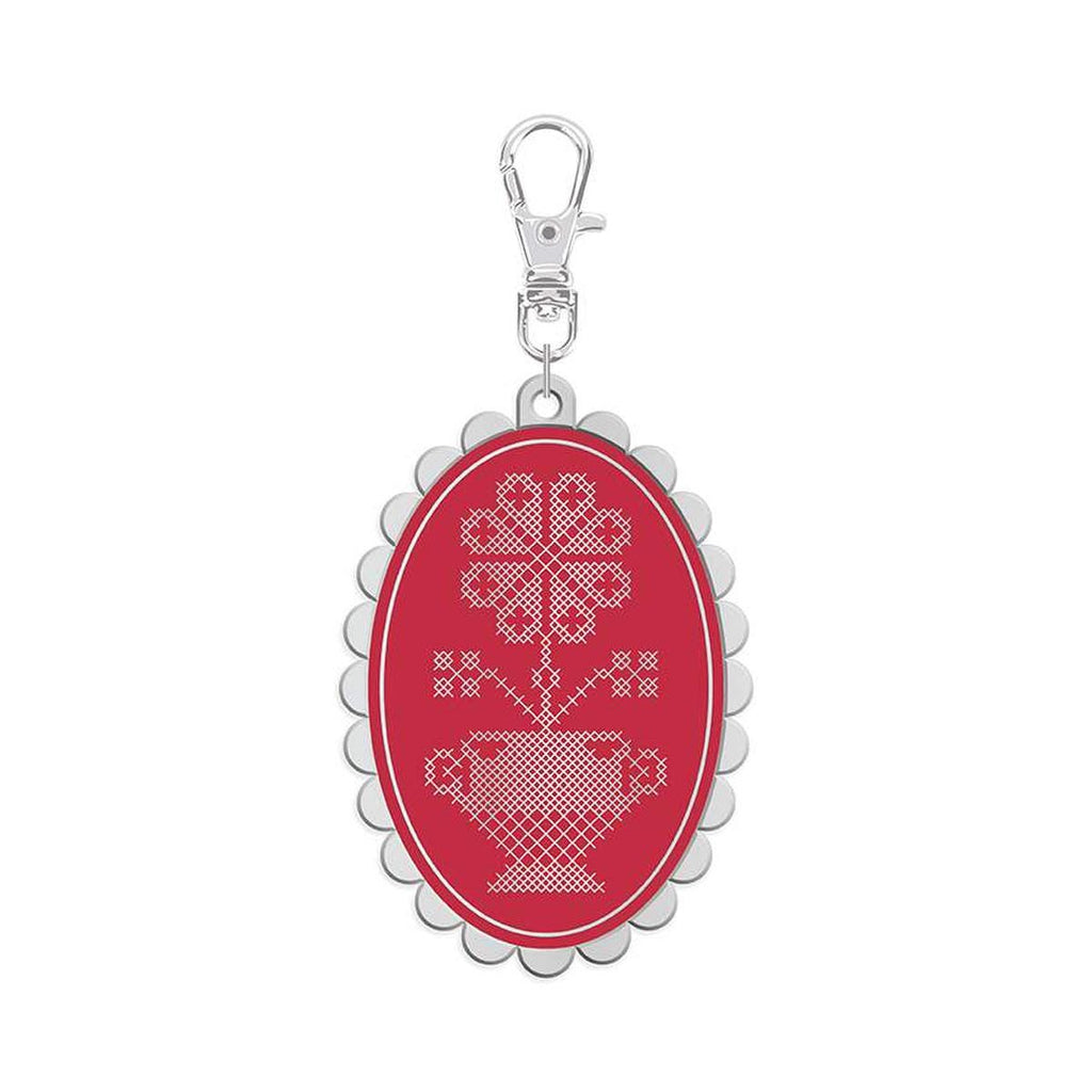 Features the Enamel Happy Charm™ Cross Stitch by Lori Holt for Riley Blake Designs. Features a  floral cross stitch charm. 
Cute Little Fabric Shop