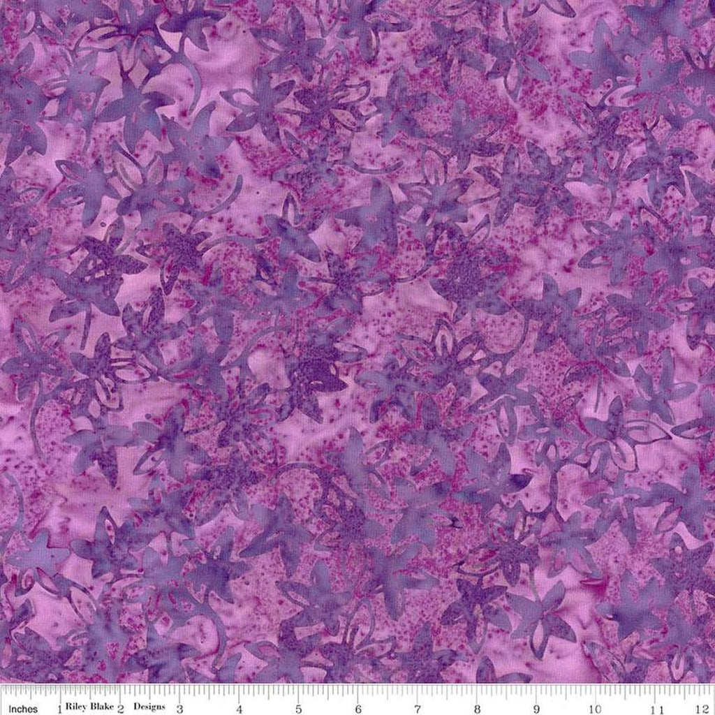Image of the Expressions Batiks Bedazzled! Grape Soda quilting cotton fabric by Pat Fryer for Riley Blake Designs. Features a flower star pattern on a purple background. 
Cute Little Fabric Shop