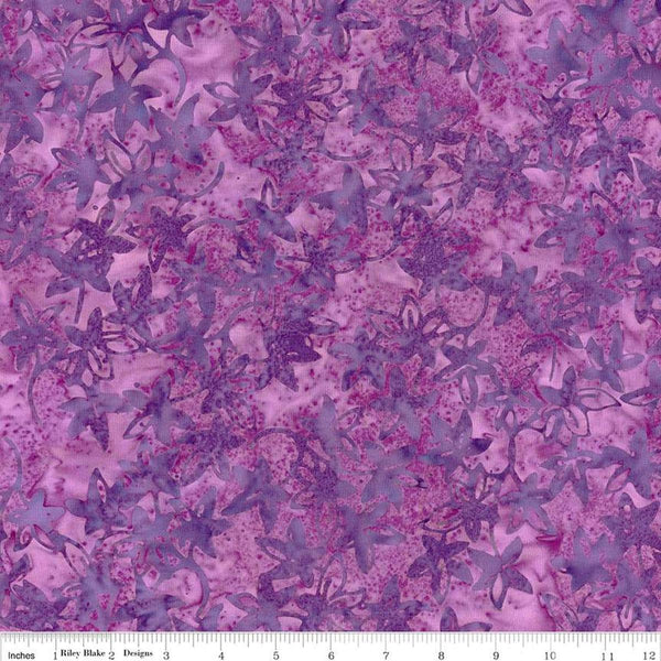 Image of the Expressions Batiks Bedazzled! Grape Soda quilting cotton fabric by Pat Fryer for Riley Blake Designs. Features a flower star pattern on a purple background. 
Cute Little Fabric Shop