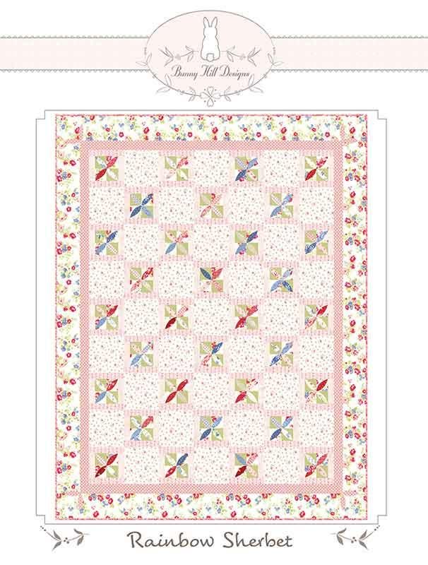Image of the Rainbow Sherbet quilt pattern by Anne Sutton for Moda Fabrics. Features a quilt with pink and floral fabrics. 
Cute Little Fabric Shop