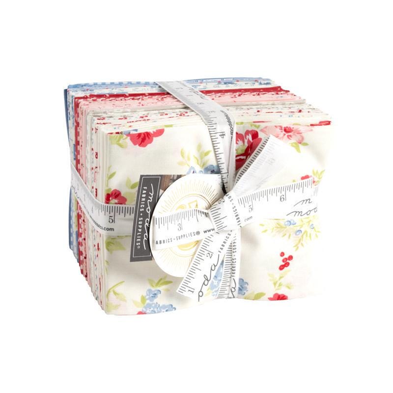 Image of the Hollyhocks and Roses 31 piece fat quarter bundle. Features floral fabrics with pink, white, and blue. 
Cute Little Fabric Shop