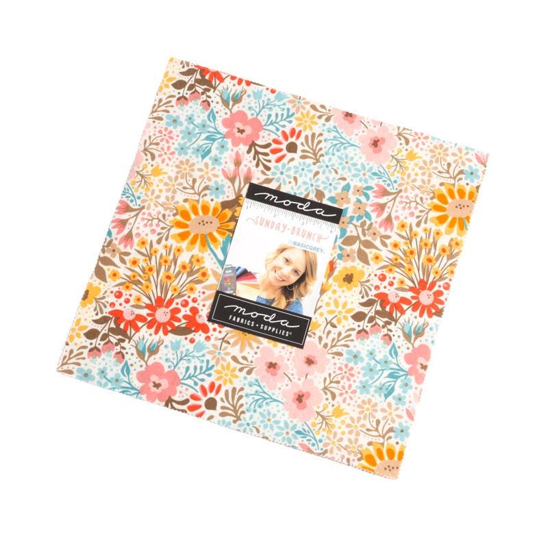 Image of the Sunday Brunch layer cake by BasicGrey for Moda Fabrics. Features floral fabric with floral patterns. 
Cute Little Fabric Shop