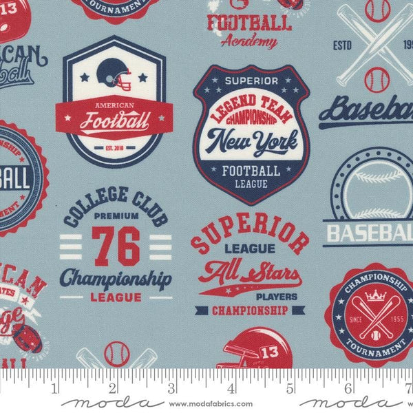 Image of the Play Ball Patchwork Dolphin quilting cotton fabric by Moda Fabrics. Features novelty baseball patchwork icons on a blue background. 
Cute Little Fabric Shop