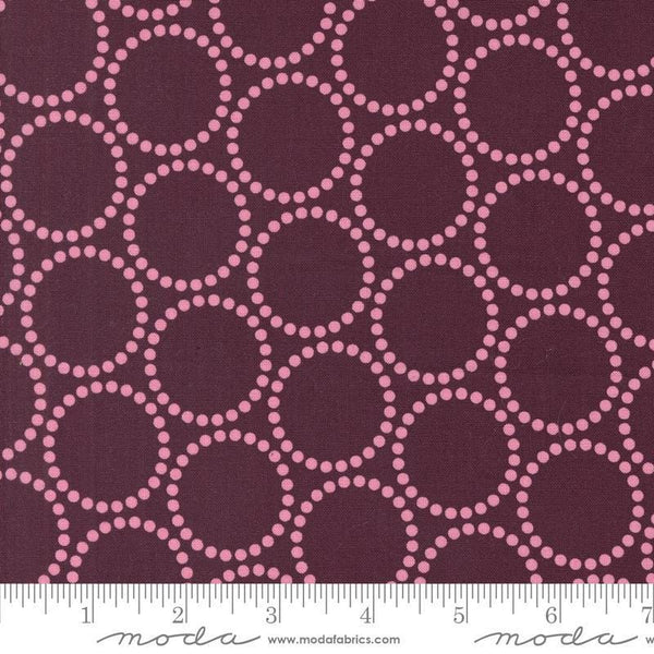 Image of the Love Letter Dots Merlot quilting cotton fabric by Lizzy House for Moda Fabrics. Features dotted circles on a purple background. Cure Little Fabric Shop
