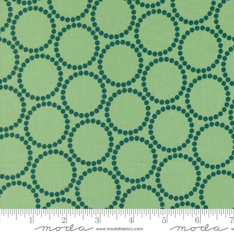 Image of the Love Letter Dots Cucumber quilting cotton fabric by Lizzy House for Moda Fabrics. Features dotted circles on a green background. Cure Little Fabric Shop