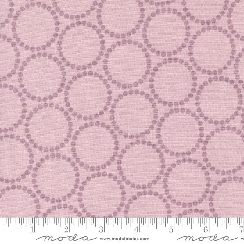 Image of the Love Letter Dots Mauve quilting cotton fabric by Lizzy House for Moda Fabrics. Features dotted circles on a pink background. Cure Little Fabric Shop