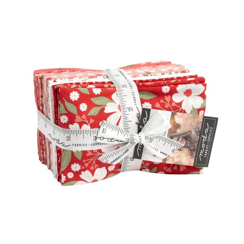 Image of the Love Blooms Fat Eighth Bundle by Moda Fabrics. Features valentine's day fabrics with red and pink backgrounds. 
Cute Little Fabric Shop