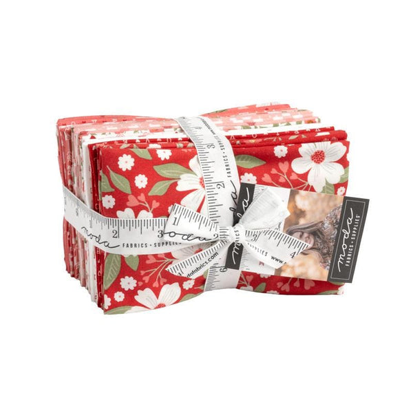 Image of the Love Blooms Fat Eighth Bundle by Moda Fabrics. Features valentine's day fabrics with red and pink backgrounds. 
Cute Little Fabric Shop