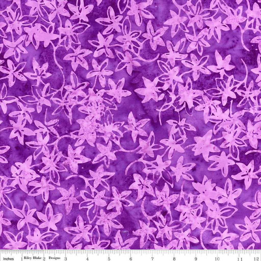 Image of the Expressions Batiks Bedazzled! Mountain's Majesty quilting cotton fabric by Pat Fryer for Riley Blake Designs. Features a flower star pattern on a purple background. 
Cute Little Fabric Shop