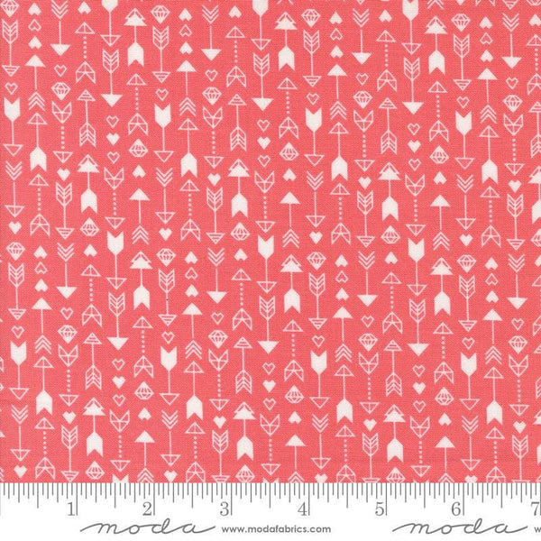 Image of the Love Blooms Arrow Lipstick quilting cotton fabric by Moda Fabrics. Features arrows on a red background. Cute Little Fabric Shop