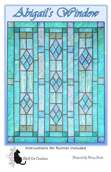 Image of the Abigail's Window quilt pattern by Black Cat Creations for Riley Blake Designs. Features a stained glass design. 
Cute Little Fabric Shop