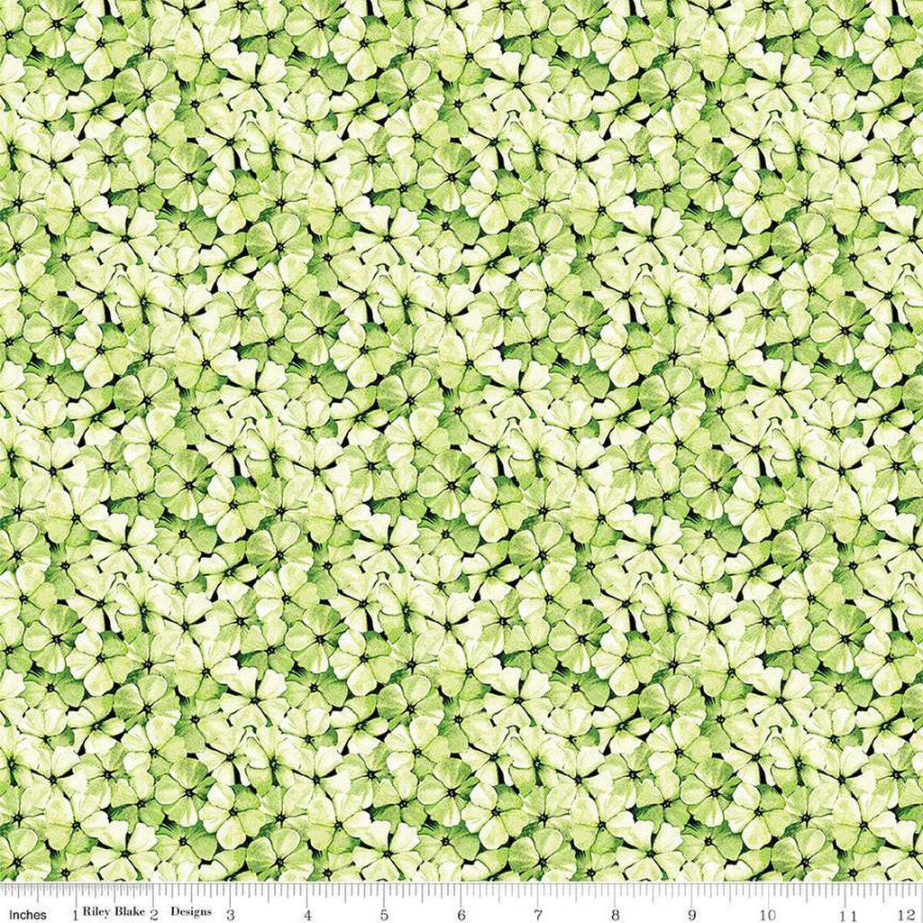 Image of the Sewing Seeds III Phlox Petals Green quilting cotton fabric by Lori Holt for Riley Blake Designs. Features flowers on a green background. Cute Little Fabric Shop