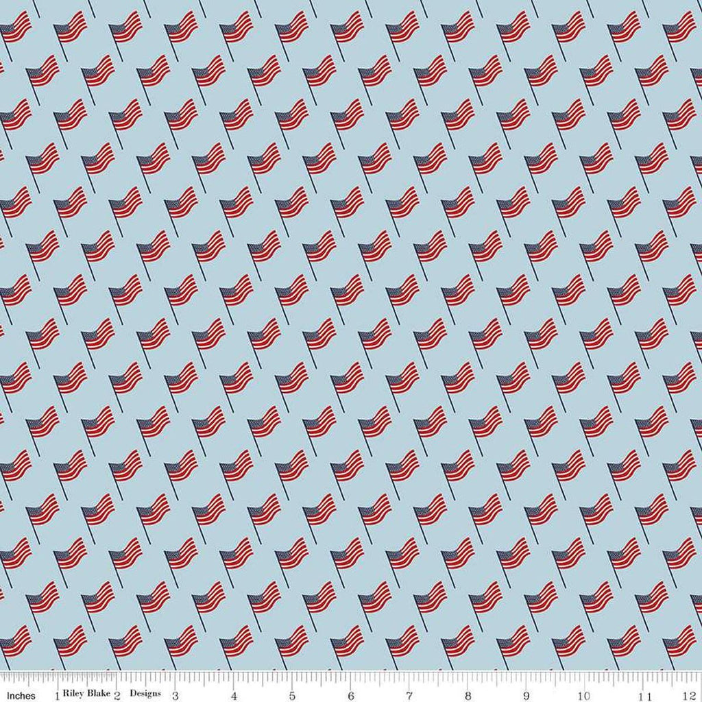 Image of the Stars and Stripes Forever Flags Sky quilting cotton fabric by Lori Whitlock for Riley Blake Designs. Features flags on a blue background. Cute Little Fabric Shop