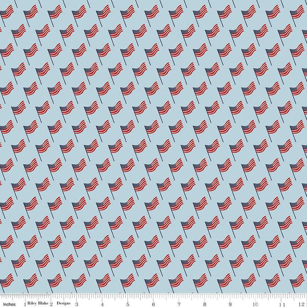Image of the Stars and Stripes Forever Flags Sky quilting cotton fabric by Lori Whitlock for Riley Blake Designs. Features flags on a blue background. Cute Little Fabric Shop