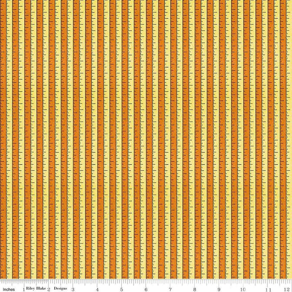 Image of the Costume Maker's Act II Tape Measure Yellow quilting cotton fabric. Features rulers on an orange background. Cute Little Fabric Shop