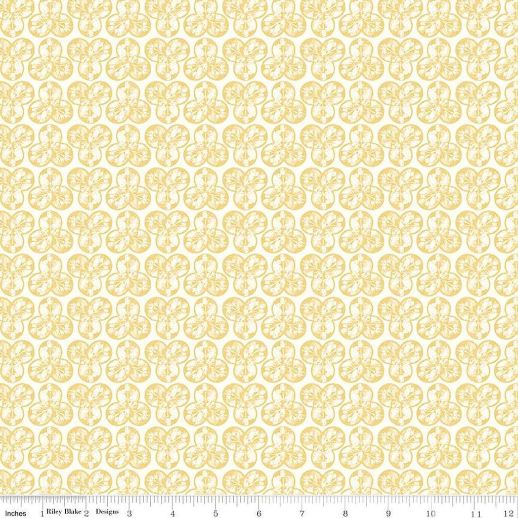 Image of the Nature's Portrait Trifolium Yellow quilting cotton fabric by Riley Blake Designs. Features leaves on a yellow background. Cute Little Fabric Shop