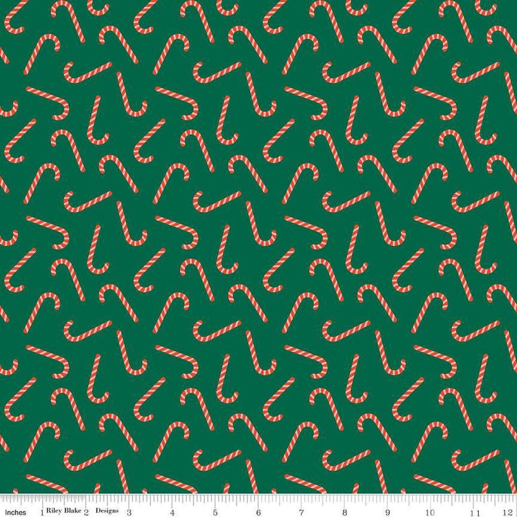 Image of the Flannel Candy Canes Green quilting cotton fabric by Riley Blake Designs. Features candy canes on a green background. Cute Little Fabric Shop