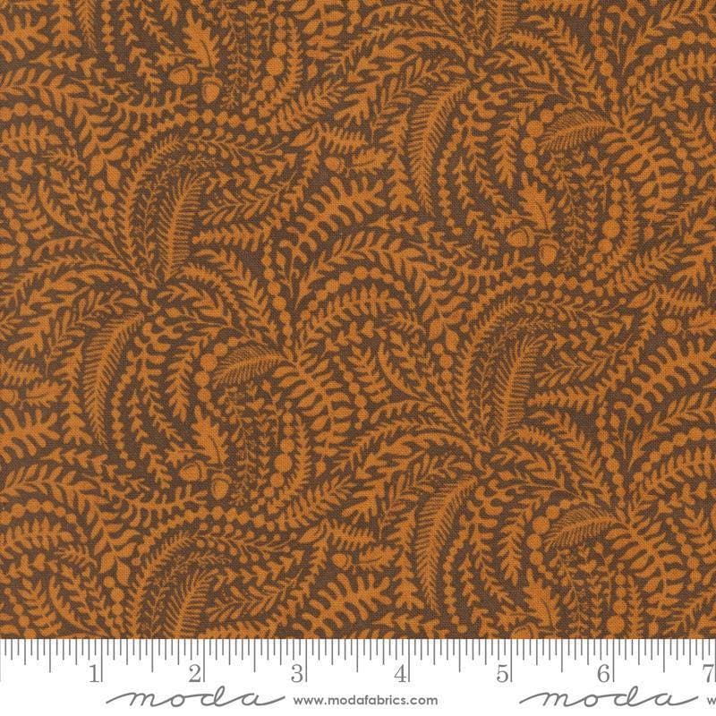 Image of the Acorn Hollow Vines Yam quilting cotton fabric by Moda Fabrics. Features vines on a brown background. Cute Little Fabric Shop