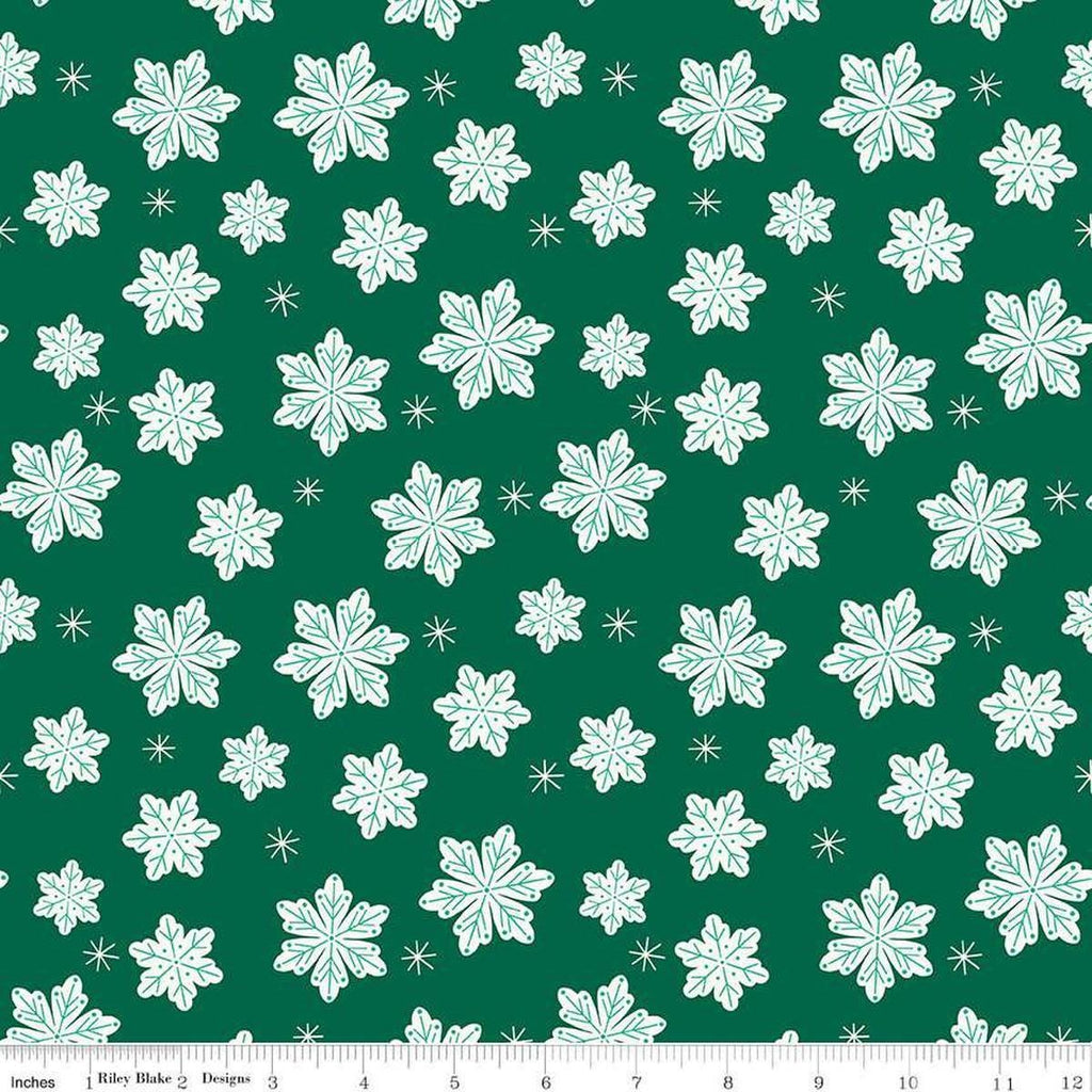 Image of the Flannel Snowflakes Green quilting cotton fabric by Riley Blake Designs. Features snowflakes on a green background. Cute Little Fabric Shop
