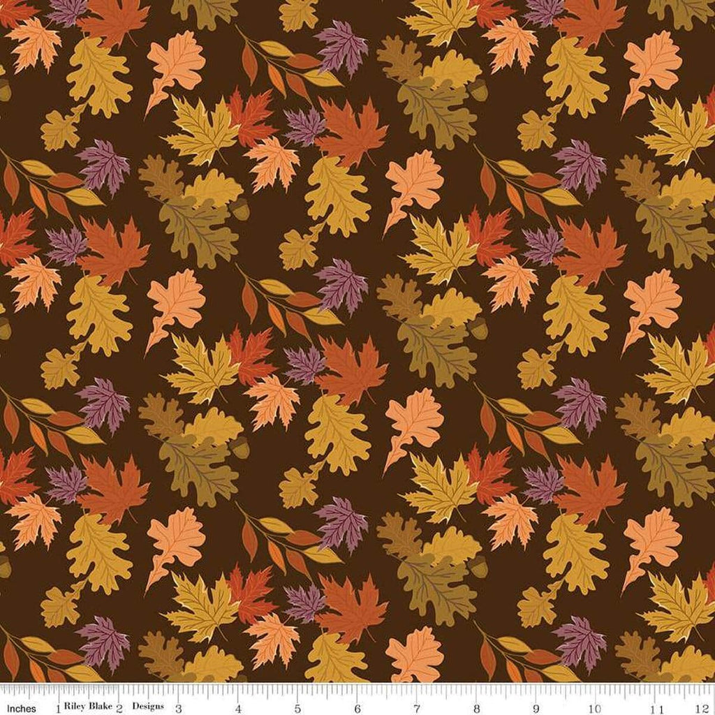 Image of the Awe of Autumn Leaves Brown quilting cotton fabric by Riley Blake Designs. Features leaves on a brown background. Cute Little Fabric Shop