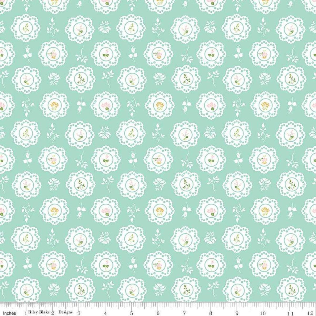 Image of the Summer Skies and Fireflies Doilies Aqua Quilting Cotton Fabric by Riley Blake Designs. Features flowers on a blue background. Cute Little Fabric Shop