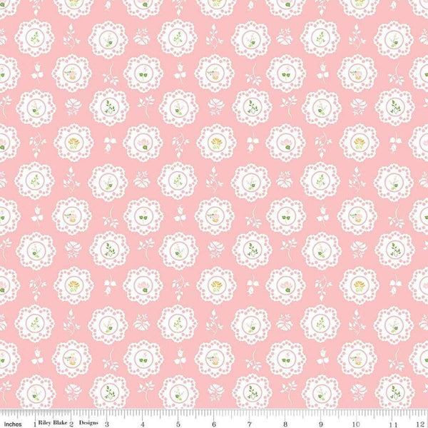 Image of the Summer Skies and Fireflies Doilies Pink Quilting Cotton Fabric by Riley Blake Designs. Features flowers on a pink background. Cute Little Fabric Shop