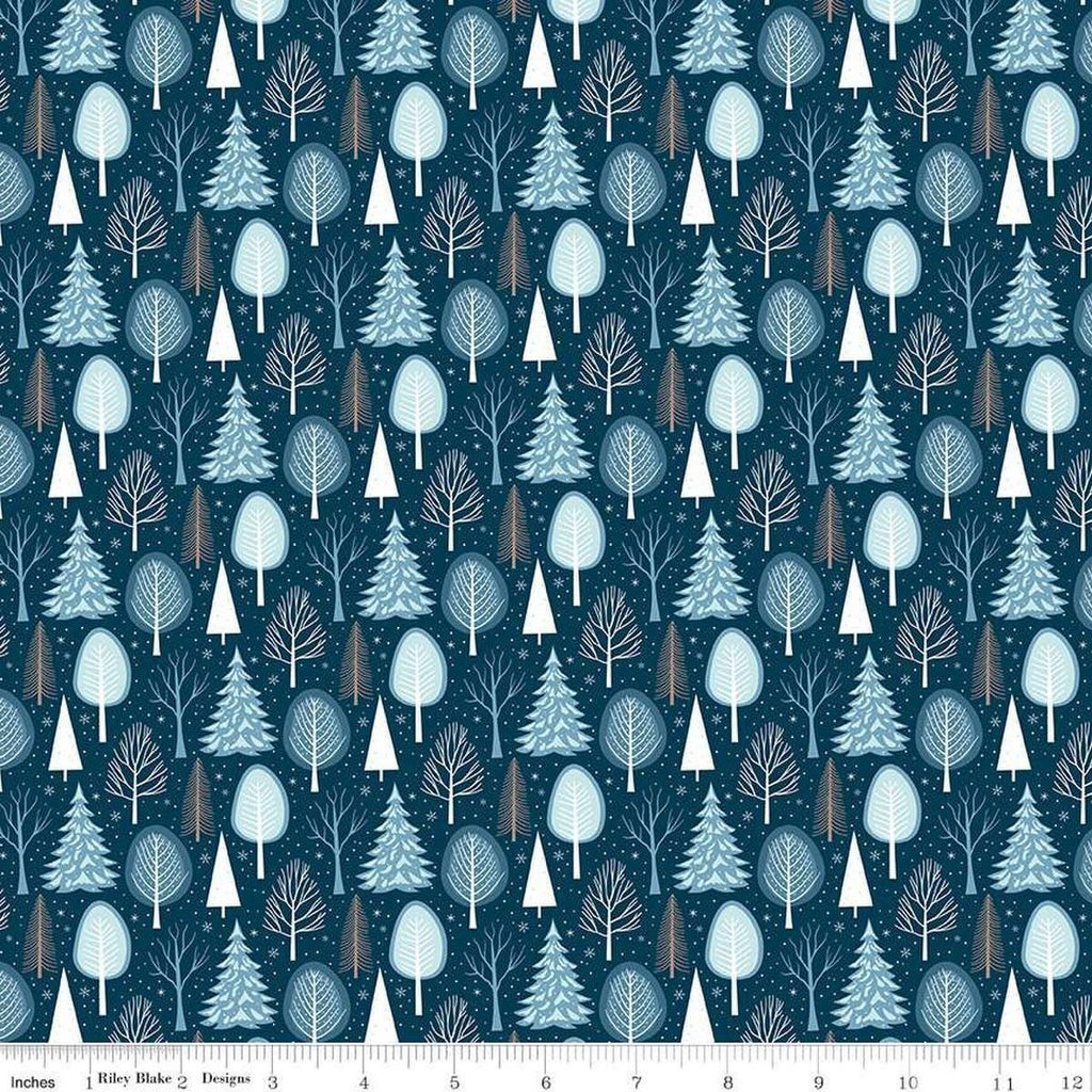 Image of the Winter Magic Trees Blue quilting cotton fabric by Riley Blake Designs. Features trees on a blue background. Cute Little Fabric Shop