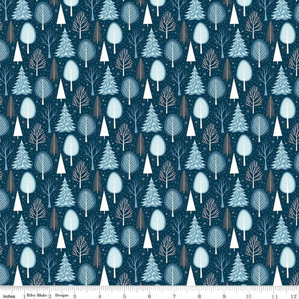 Image of the Winter Magic Trees Blue quilting cotton fabric by Riley Blake Designs. Features trees on a blue background. Cute Little Fabric Shop