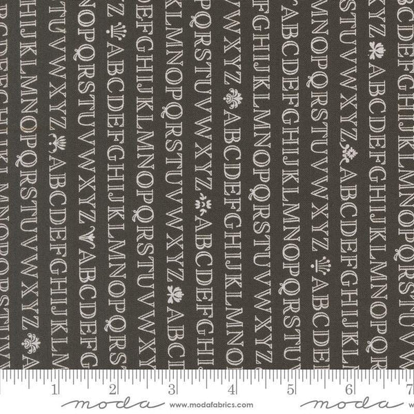Image of the Agatha Road Alphabet Midnight quilting cotton fabric by Moda Fabrics. Features letters on a black background. Cute Little Fabric Shop