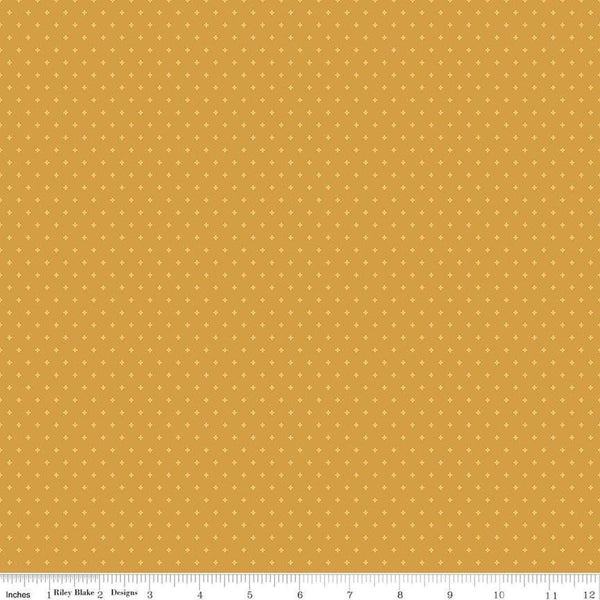 Image of Essence Foils Golden quilting cotton fabric by Fran Gulick for Riley Blake Designs. Features stars on a yellow background. Cute Little Fabric Shop
