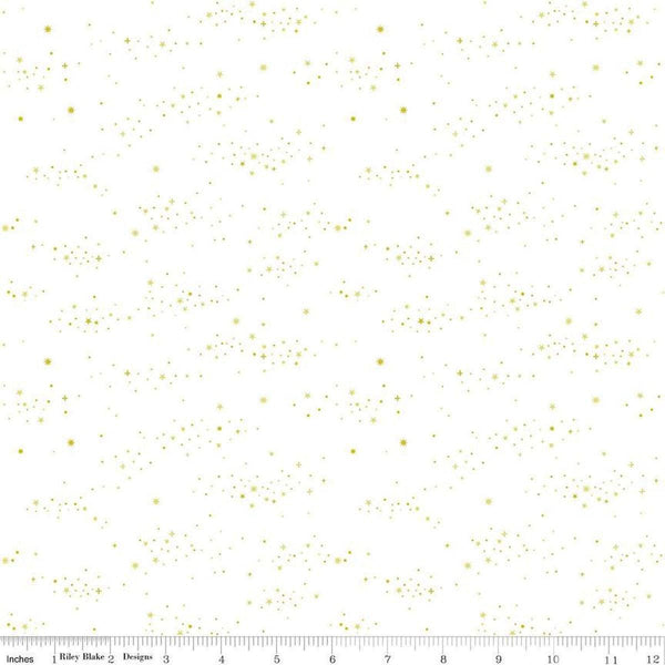 Image of Essence Starlight Gold quilting cotton fabric by Fran Gulick for Riley Blake Designs. Features stars on a white background. Cute Little Fabric Shop